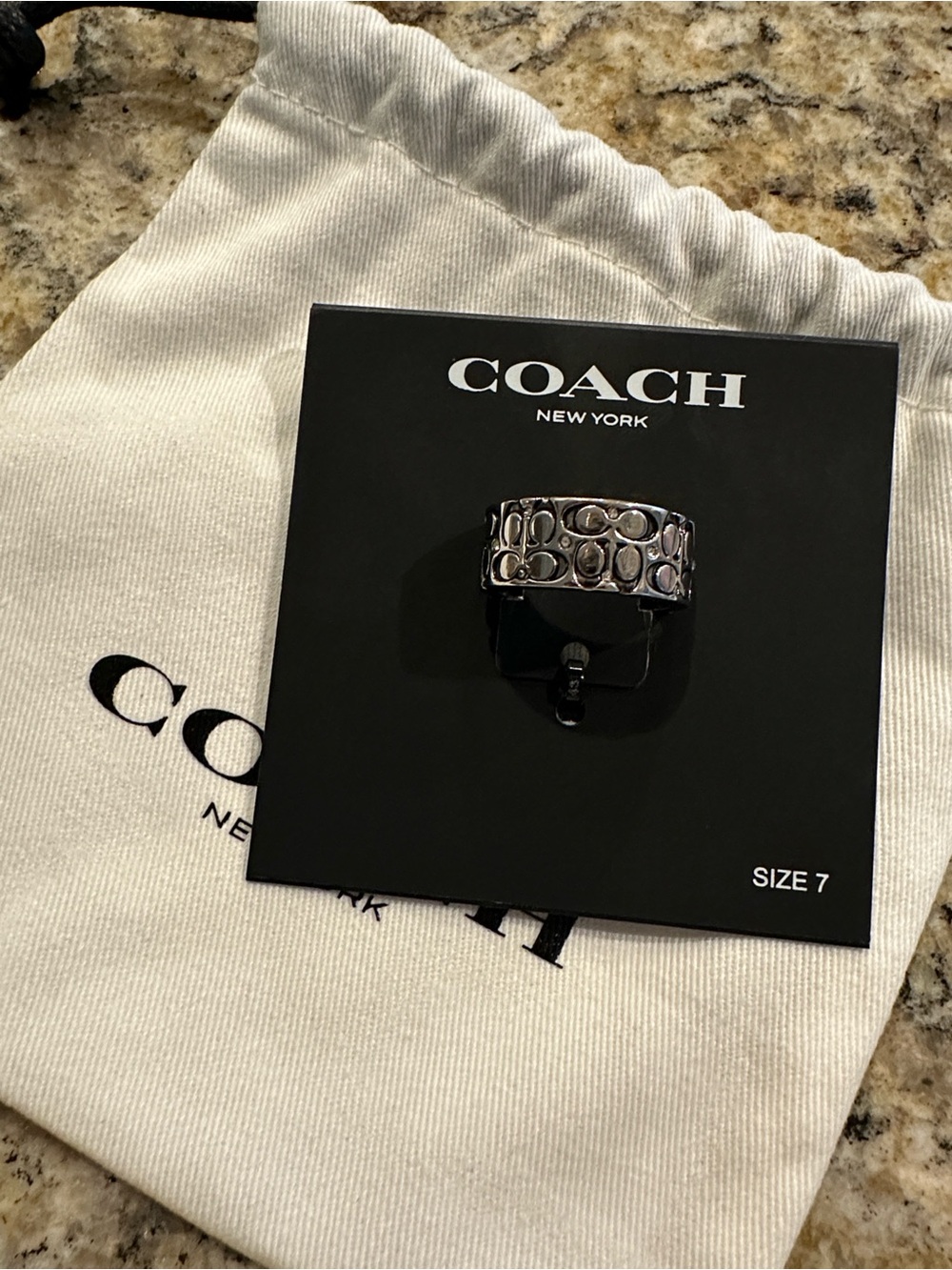 Coach Silver-Tone Crystal Quilted C
Wide Band Ring - Size 7